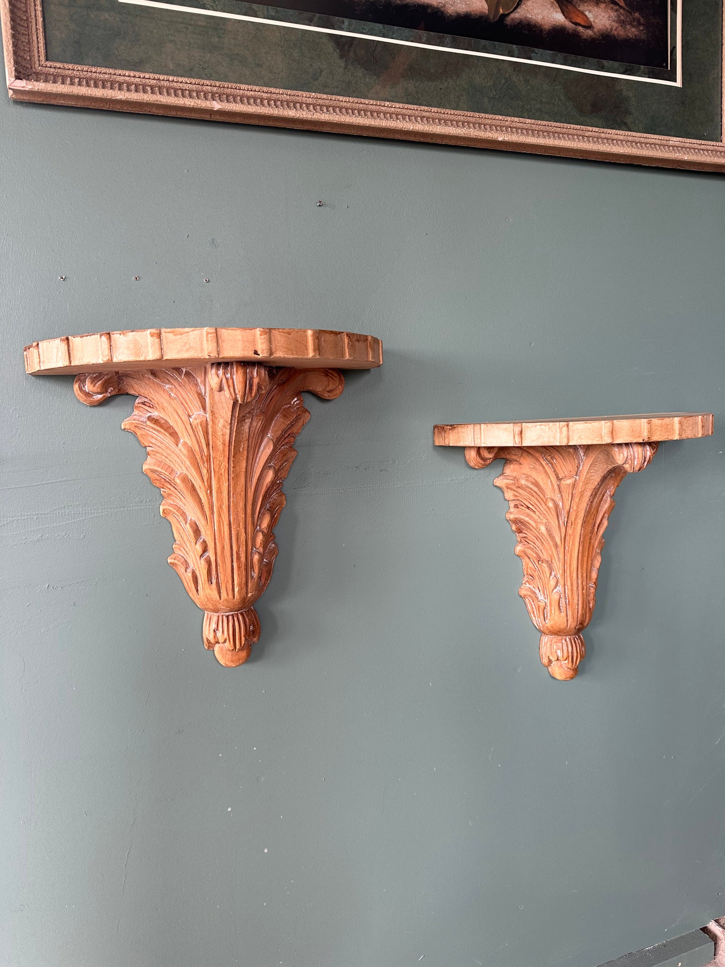 Pair of vintage carved wood wall shelves.